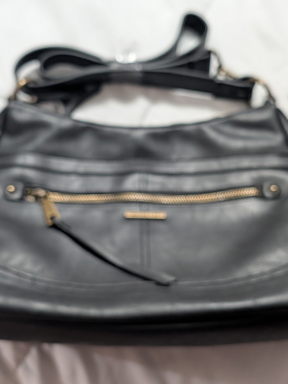 Rosetti Black Crossbody Bag with Front Zip Pocket and Gold Hardware